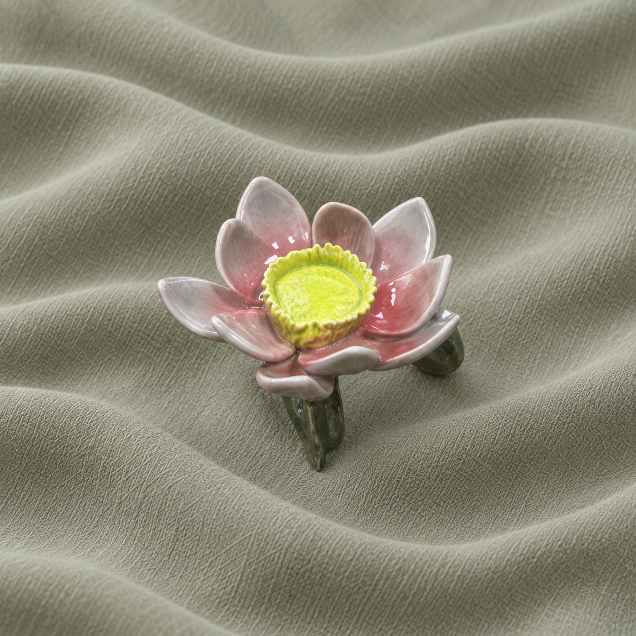 Ceramic flower napkin ring with pink petals and a green ring